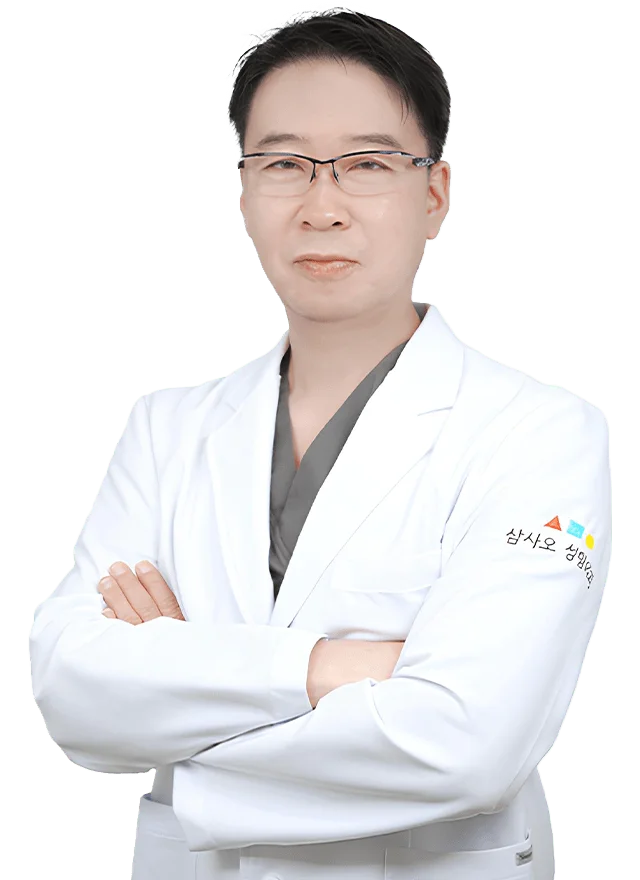 Doctor in lab coat for 345 plastic surgery where natural results are achieved.